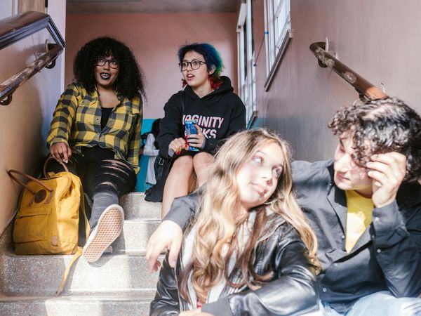 Group of diverse people sitting together in a bright, welcoming space.